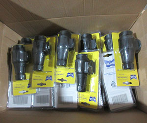Box of finished 13-pin trailer connectors in retail blister packaging, ready for shipment