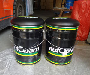 Comparing the finished storage bin with lid to the original factory sample for color and compliance.