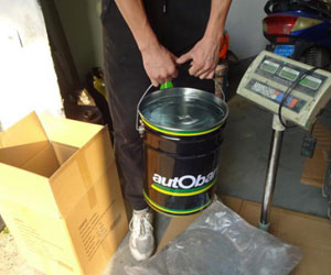 Storage stool bucket hang test conducted as part of the QC process before shipping.