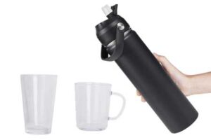 Set of black insulated bottles, a clear glass tumbler, and a mug with a handle, showing a complete travel hydration and glassware set